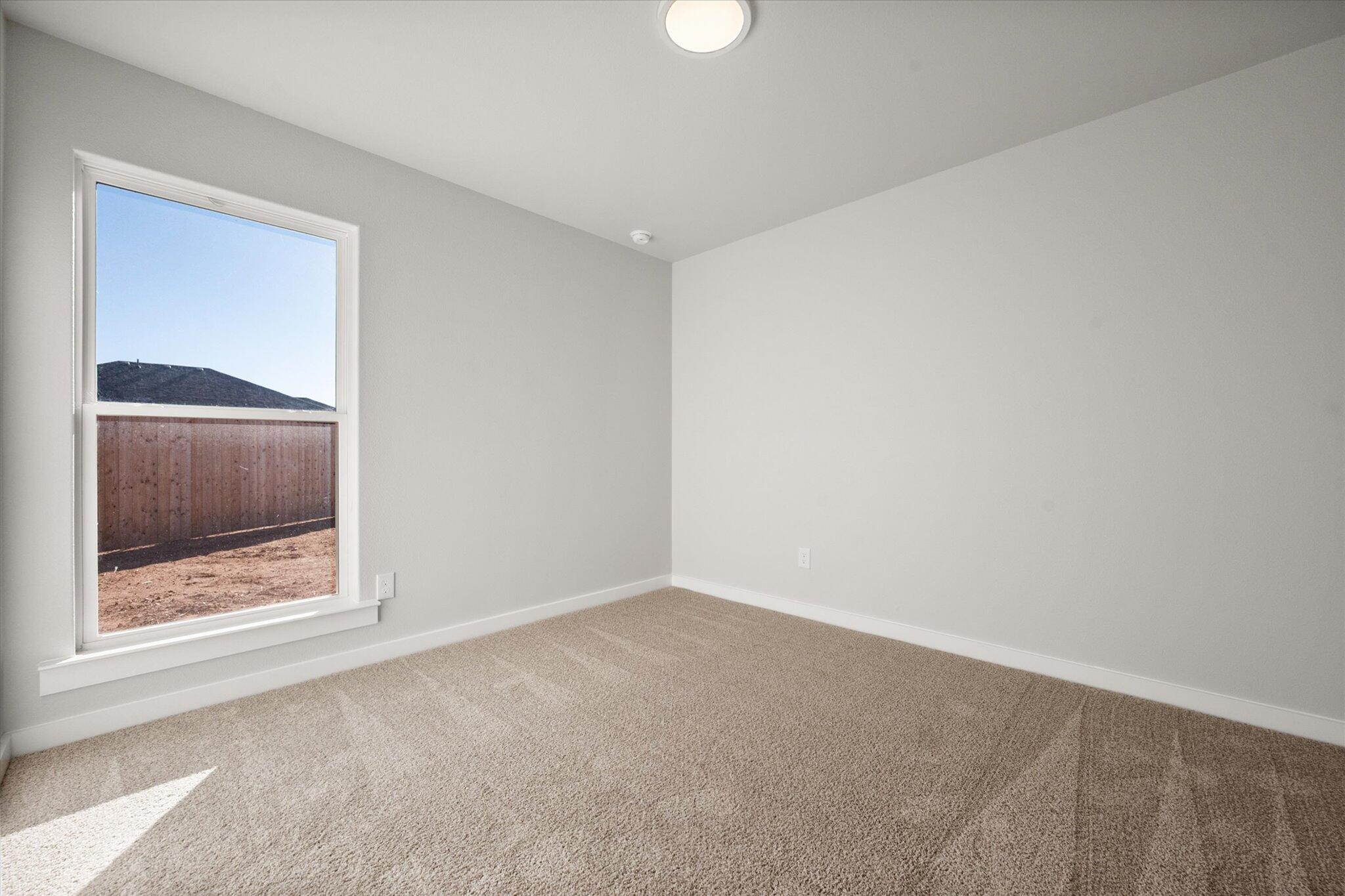 6302 Volney Avenue Lubbock, TX 79407 - Photo 17 of 20 a view of an empty room and window