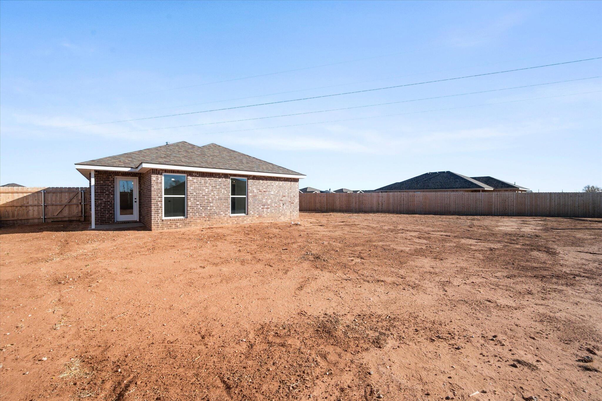 6302 Volney Avenue Lubbock, TX 79407 - Photo 20 of 20 a front view of house with yard and mountain view in back