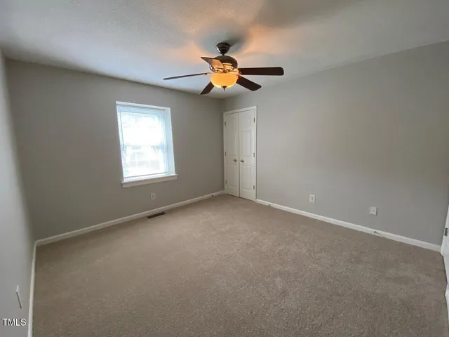 en view of an empty room with a window