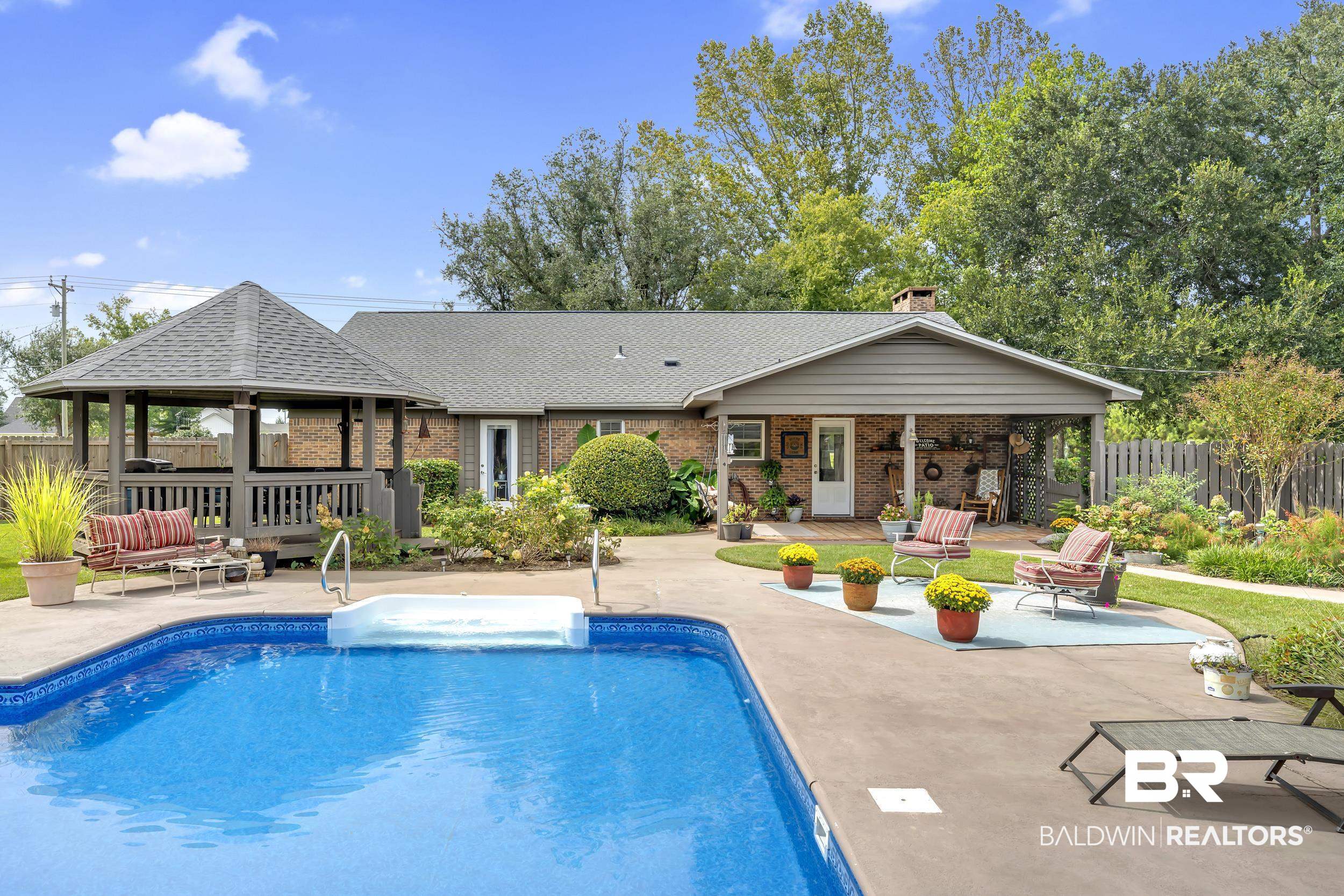 19090 Gunnison Road Fairhope, AL 36532 - Photo 30 of 42 View of swimming pool featuring a gazebo, a patio area, and an outdoor hangout area