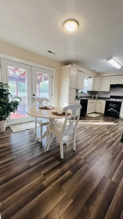 a view of kitchen with cabinets and wooden floor