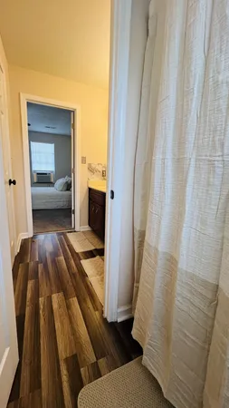 a en suite bathroom with a sink and a mirror