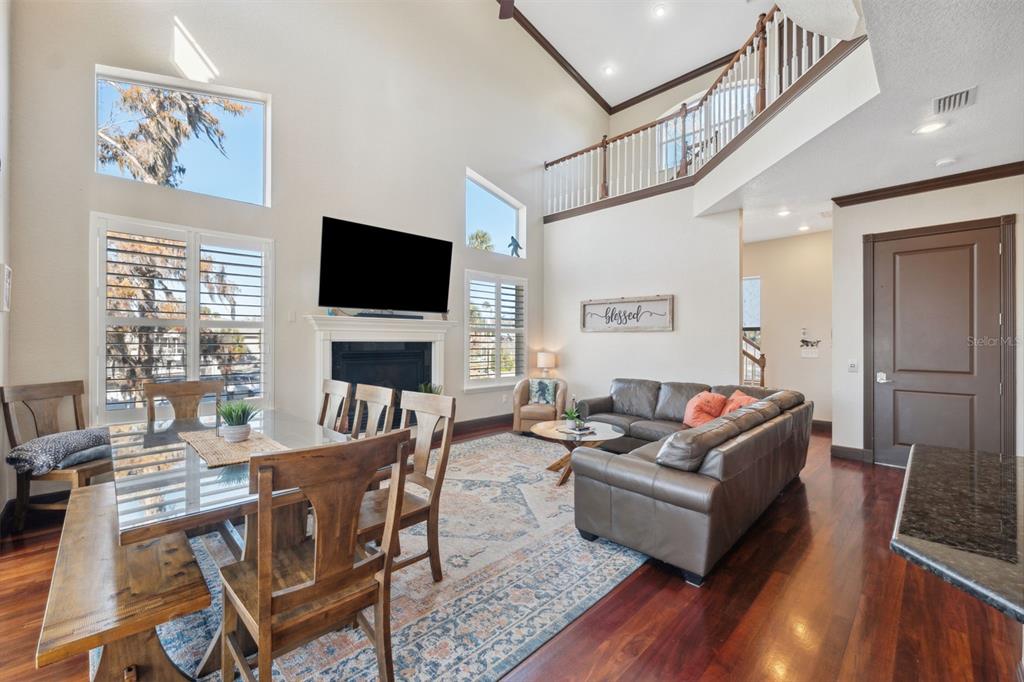 5287 Tuna Lane Weeki Wachee, FL 34607 - Photo 20 of 85 a living room with fireplace furniture and a flat screen tv