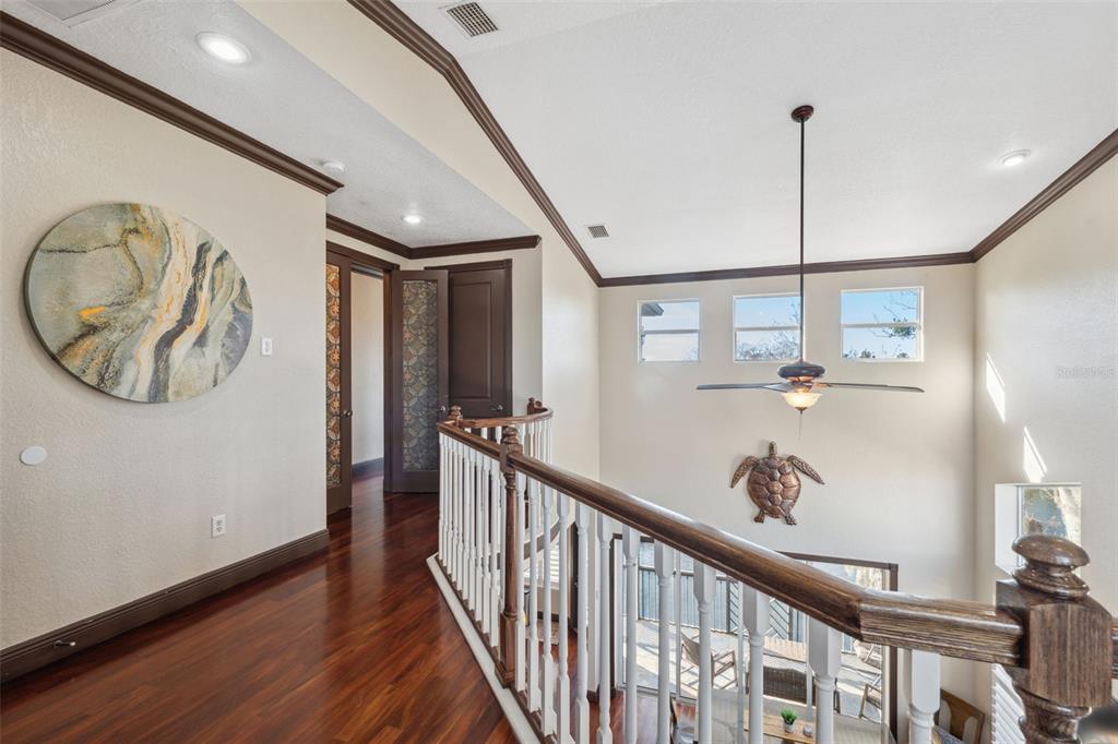 5287 Tuna Lane Weeki Wachee, FL 34607 - Photo 44 of 85 a view of a hallway with wooden floor and entryway