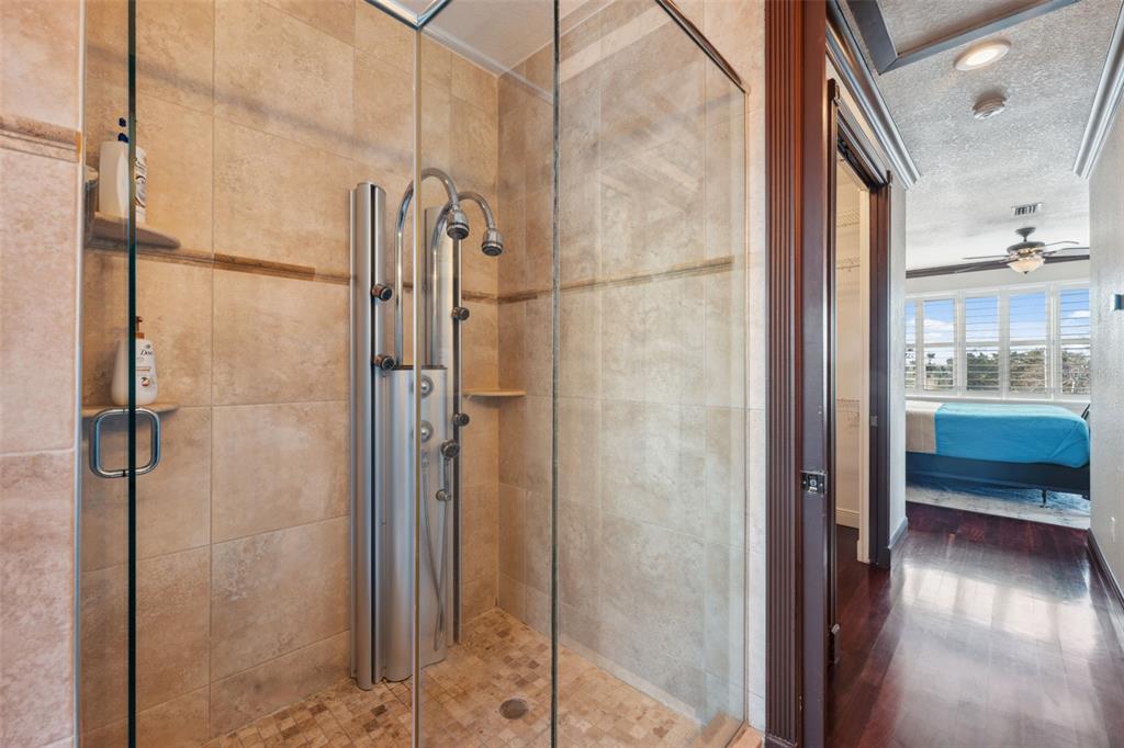 5287 Tuna Lane Weeki Wachee, FL 34607 - Photo 53 of 85 a bathroom with a glass shower door