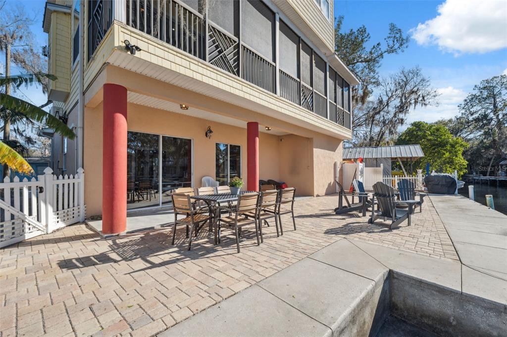 5287 Tuna Lane Weeki Wachee, FL 34607 - Photo 63 of 85 a view of a building with sitting area and furniture