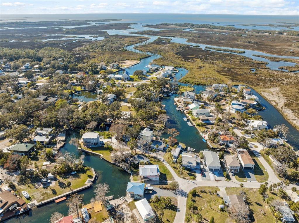 5287 Tuna Lane Weeki Wachee, FL 34607 - Photo 77 of 85 an aerial view of ocean and residential houses with outdoor space