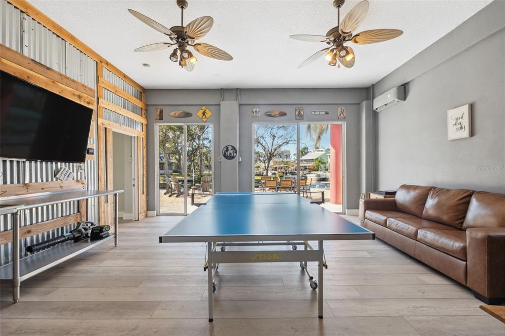 5287 Tuna Lane Weeki Wachee, FL 34607 - Photo 8 of 85 a living room with furniture and a flat screen tv