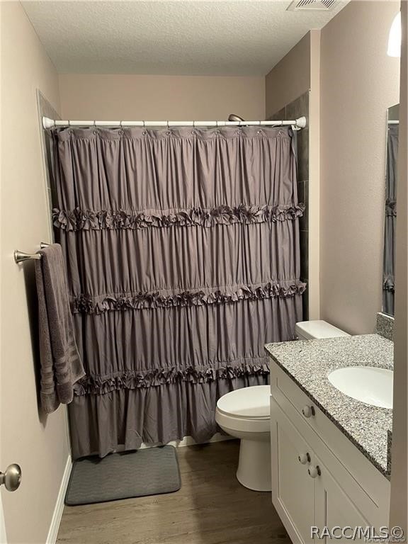 13591 Southwest 112th Street Dunnellon, FL 34432 - Photo 18 of 24 a bathroom with a granite countertop sink and a toilet