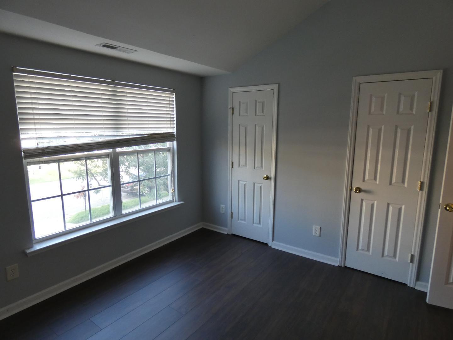 1624 Brown Owl Drive Raleigh, NC 27610 - Photo 18 of 22 a view of an empty room with wooden floor and a window