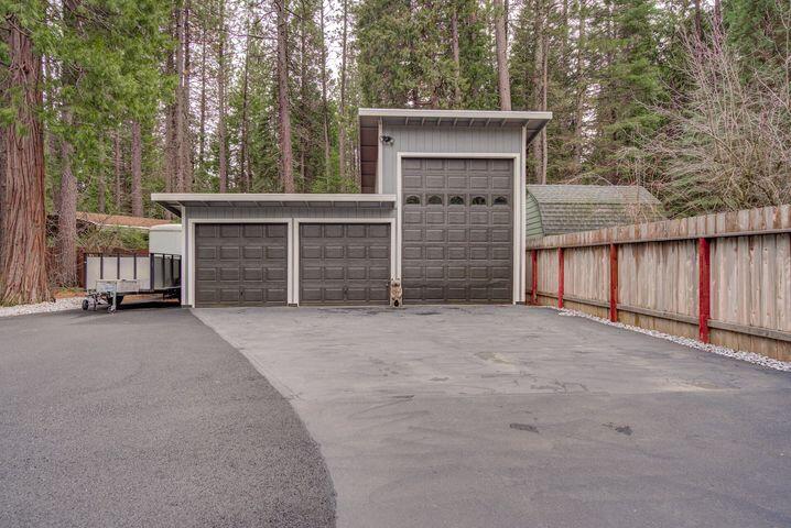 37105 Sapphire Road Burney, CA 96013 - Photo 39 of 39 a view of a house with a garage and yard