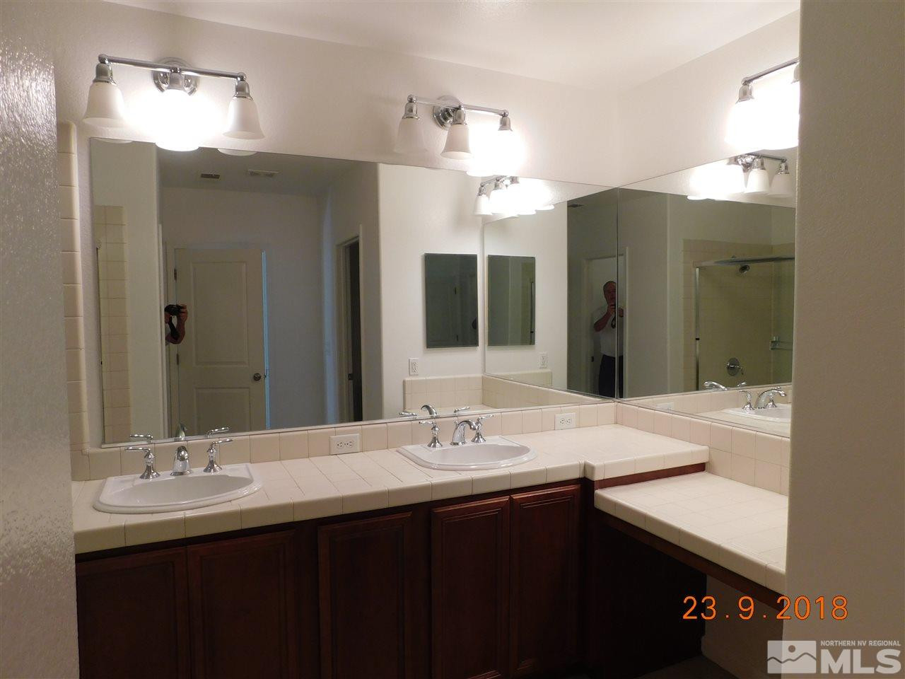 1606 Lone Oak Trail Reno, NV 89523 - Photo 10 of 10 a bathroom with a sink double vanity and a mirror