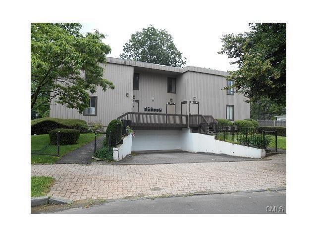 21 West Main Street, Unit C2 Norwalk, CT 06851 - Photo 1 of 1 a front view of a house with a yard