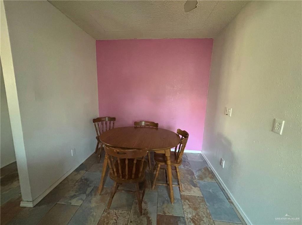 1901 South 34th Street McAllen, TX 78503 - Photo 12 of 13 a view of a dining room with furniture and wooden floor