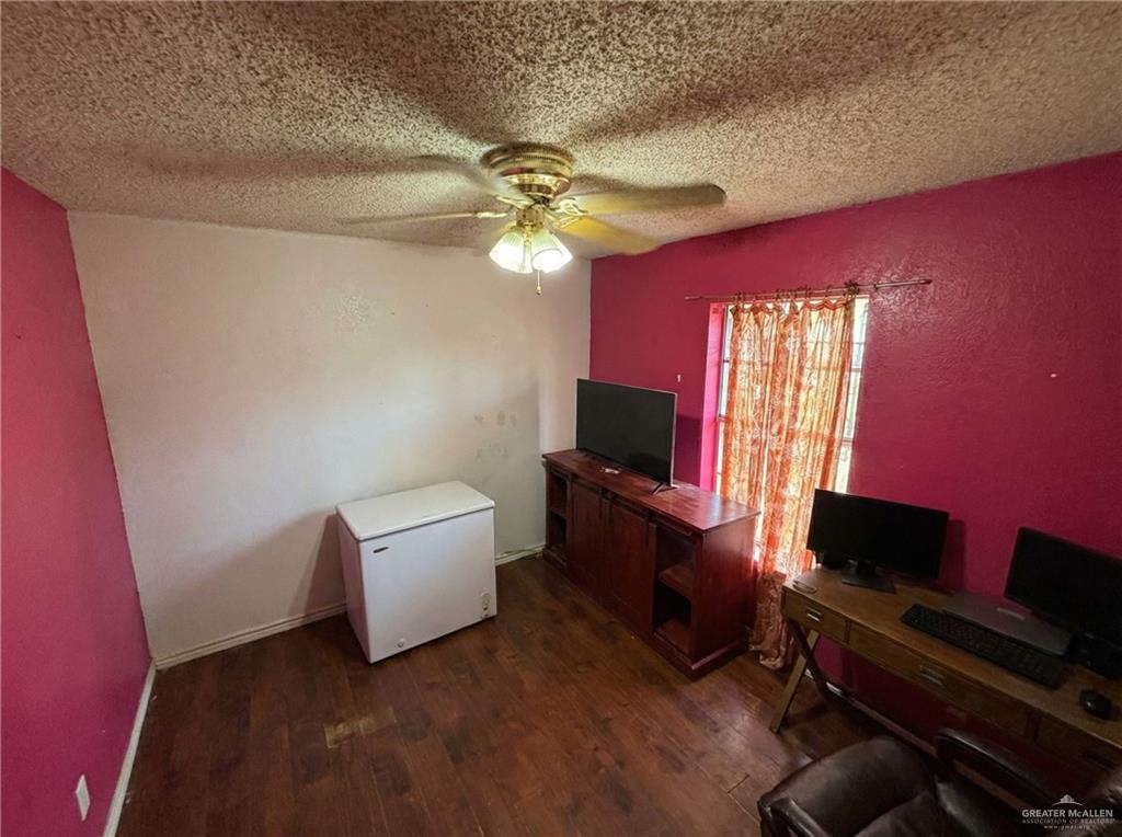 1901 South 34th Street McAllen, TX 78503 - Photo 4 of 13 a living room with furniture and a flat screen tv