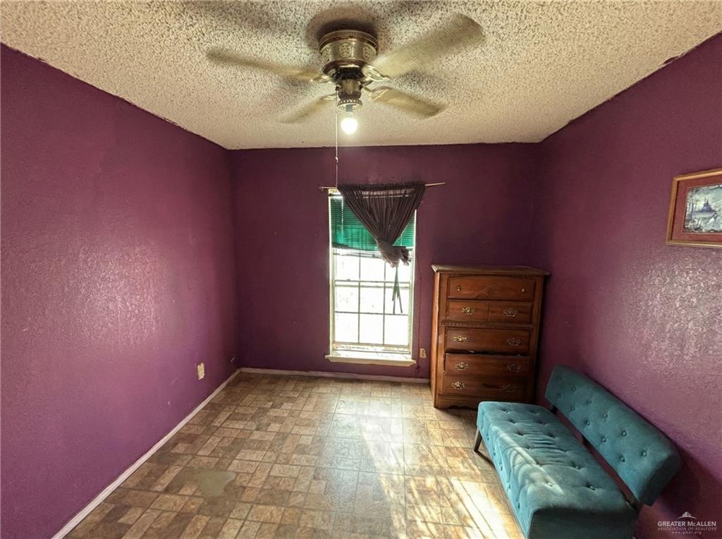 1901 South 34th Street McAllen, TX 78503 - Photo 5 of 13 a bedroom with a bed and a chandelier