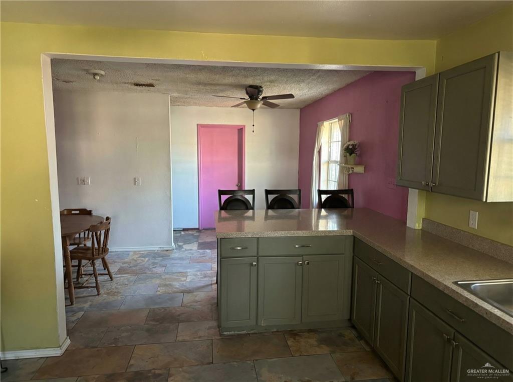1901 South 34th Street McAllen, TX 78503 - Photo 6 of 13 a kitchen with a sink a counter and cabinets