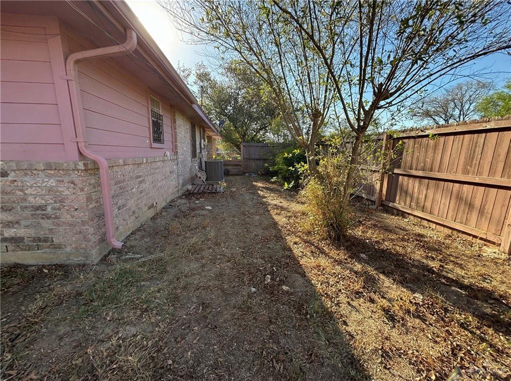 1901 South 34th Street McAllen, TX 78503 - Photo 9 of 13 a view of a yard with wooden fence