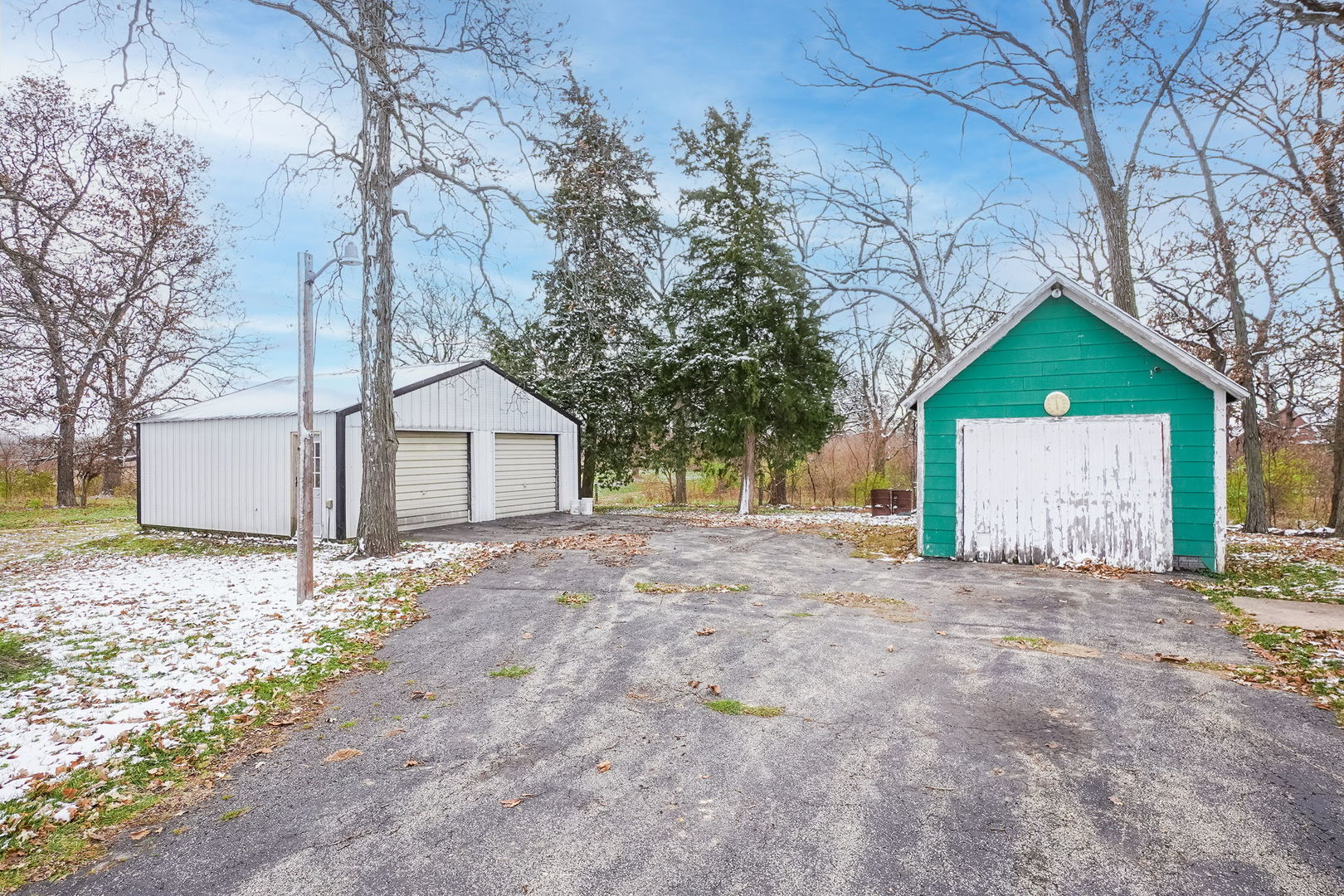 1737 Lee Center Road Amboy, IL 61310 - Photo 14 of 19 a house with trees in front of it