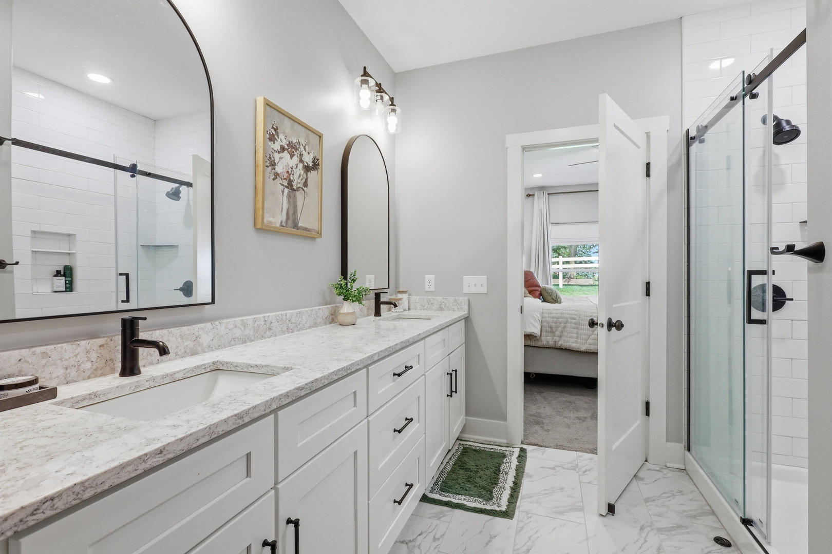 6779 Genesis Way Bettendorf, IA 52722 - Photo 21 of 36 a spacious bathroom with a double vanity sink mirror and shower
