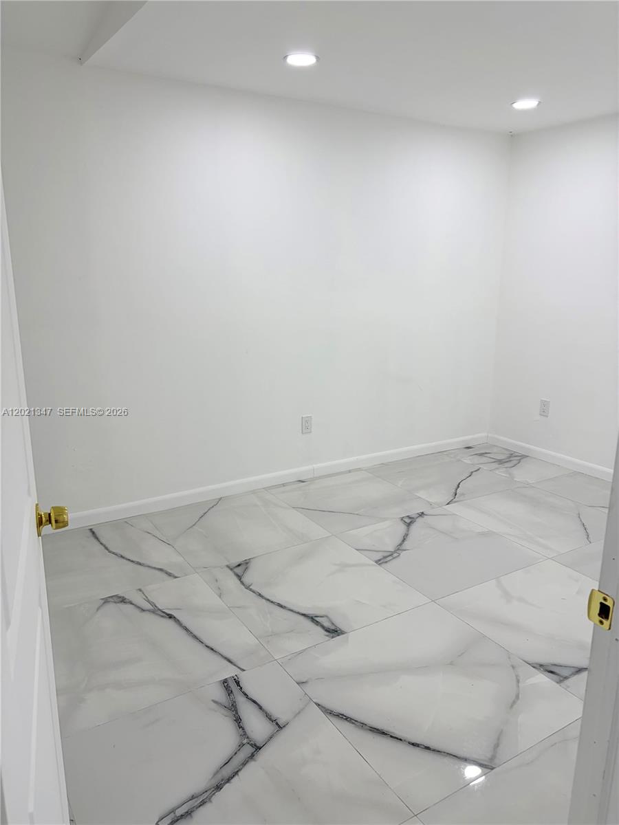 13065 Southwest 263rd Terrace, Unit 2 Homestead, FL 33032 - Photo 12 of 15 a view of a room with white wall