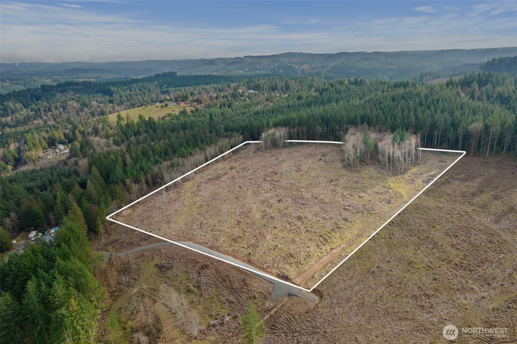 a view of a dry yard with mountain
