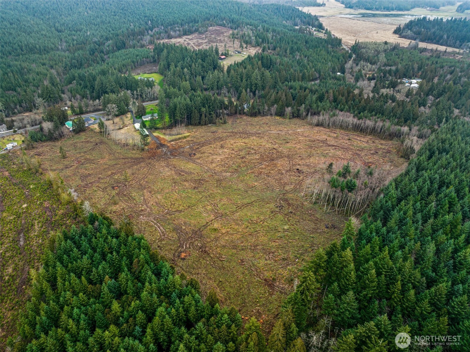 0 Little Hanaford Road, Unit C Centralia, WA 98531 - Photo 4 of 21 a view of a dirt road with a building in the background