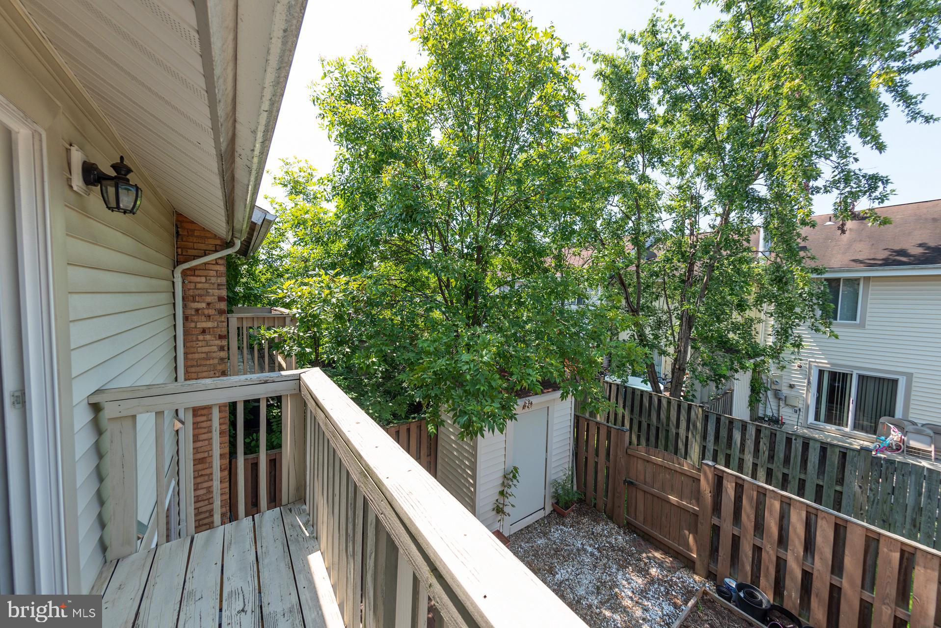 13349 Shea Place Herndon, VA 20170 - Photo 13 of 26 a balcony with trees in front of it