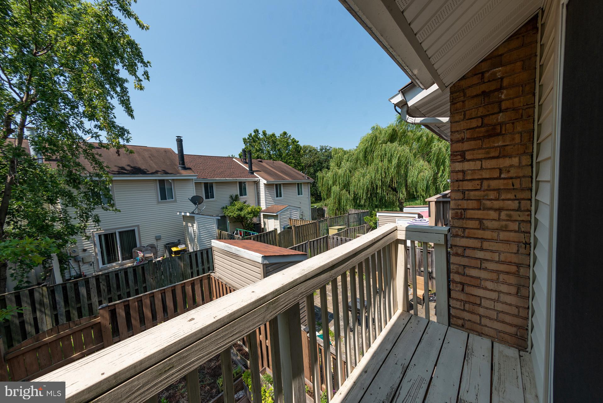 13349 Shea Place Herndon, VA 20170 - Photo 15 of 26 a view of balcony with wooden floor and fence