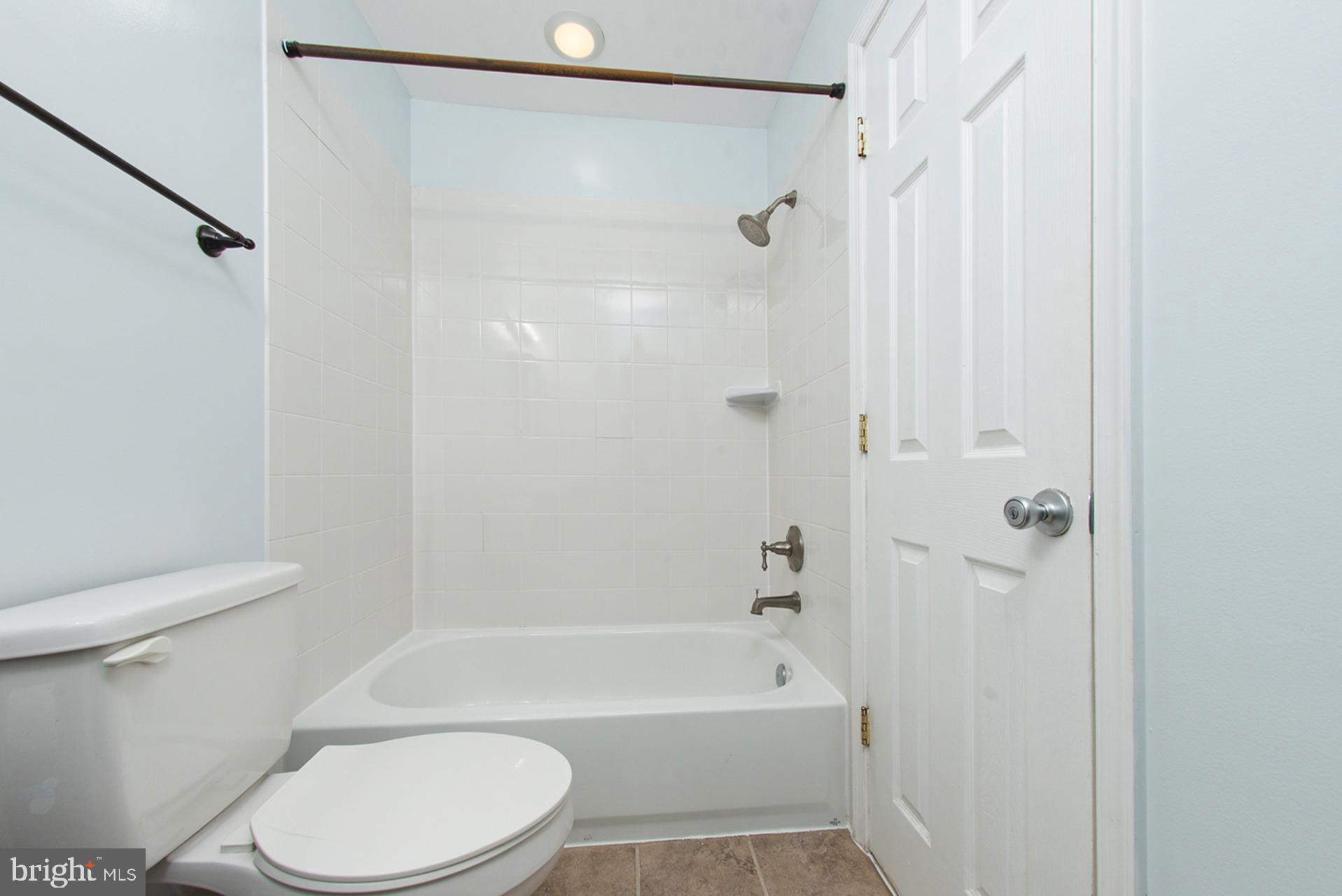 13349 Shea Place Herndon, VA 20170 - Photo 19 of 26 a bathroom with a toilet and a shower