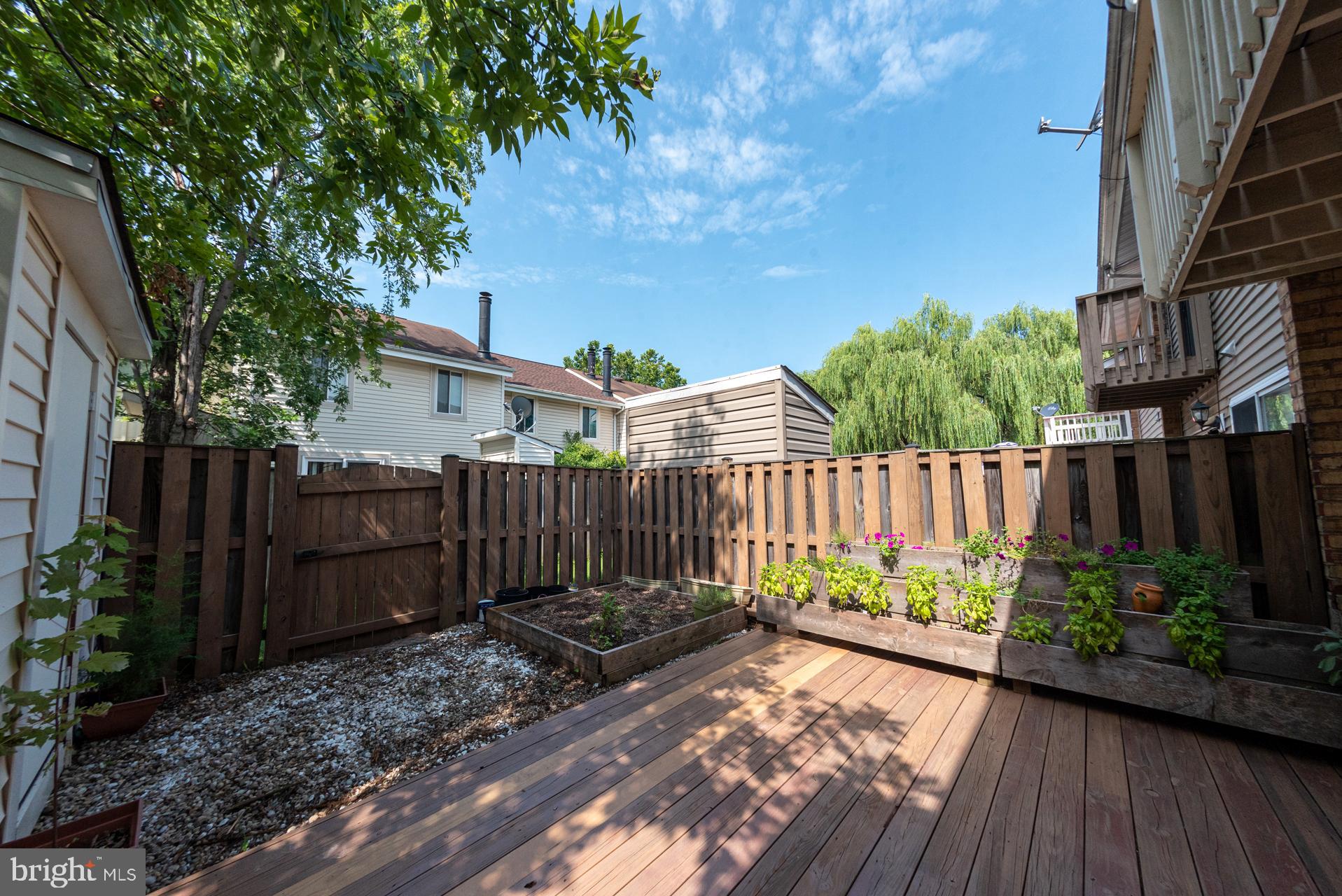 13349 Shea Place Herndon, VA 20170 - Photo 24 of 26 a view of a garden with wooden fence