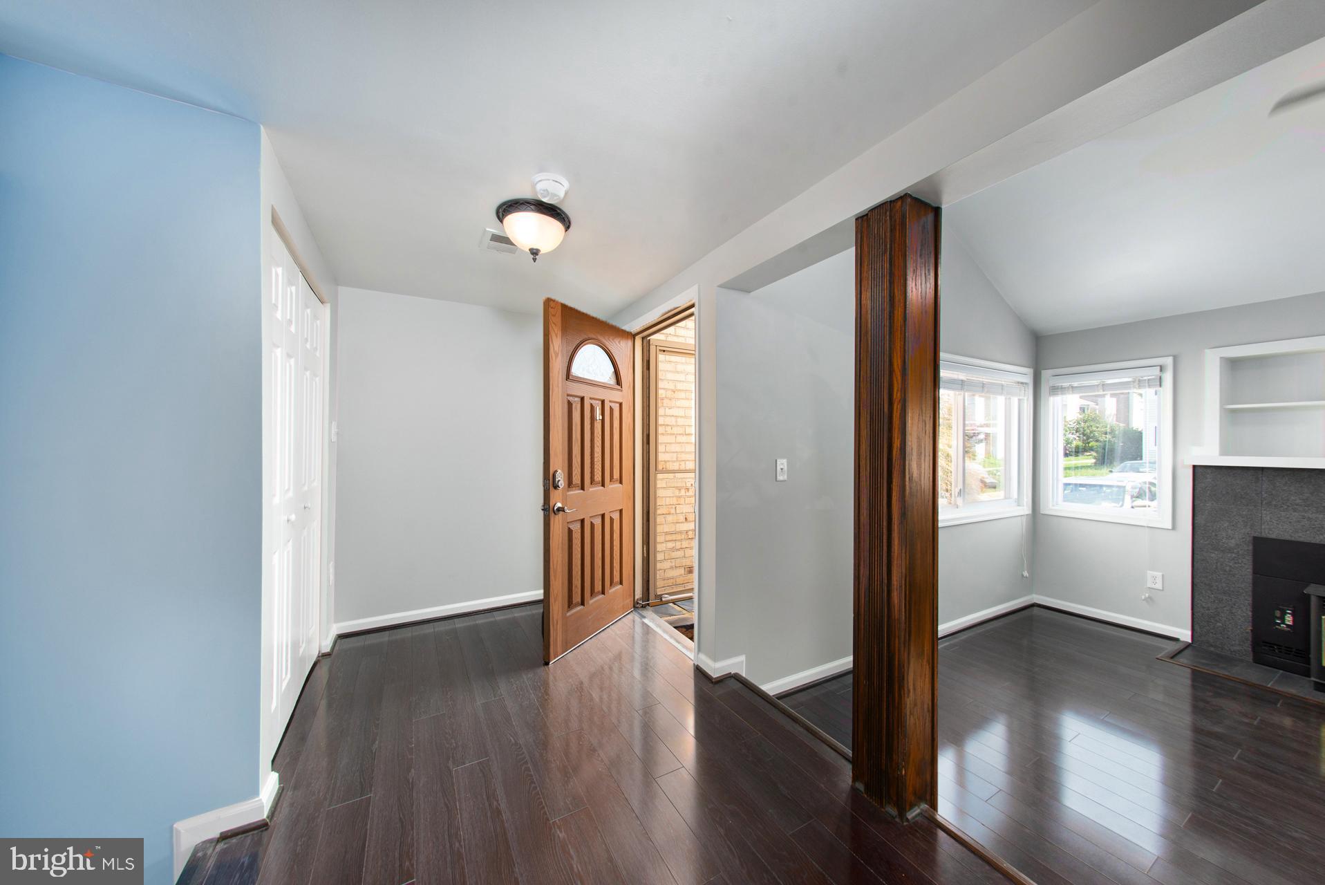 13349 Shea Place Herndon, VA 20170 - Photo 5 of 26 a view of an empty room with wooden floor and a window