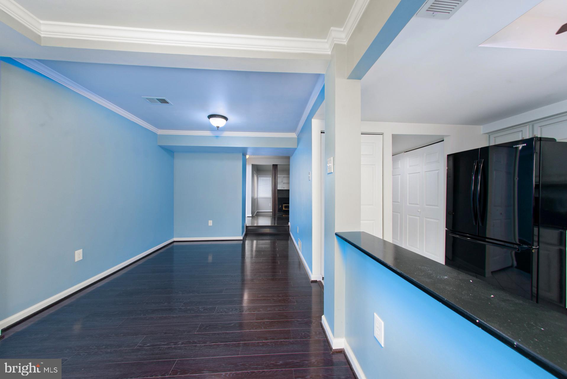 13349 Shea Place Herndon, VA 20170 - Photo 9 of 26 a view of a hallway with wooden floor and staircase