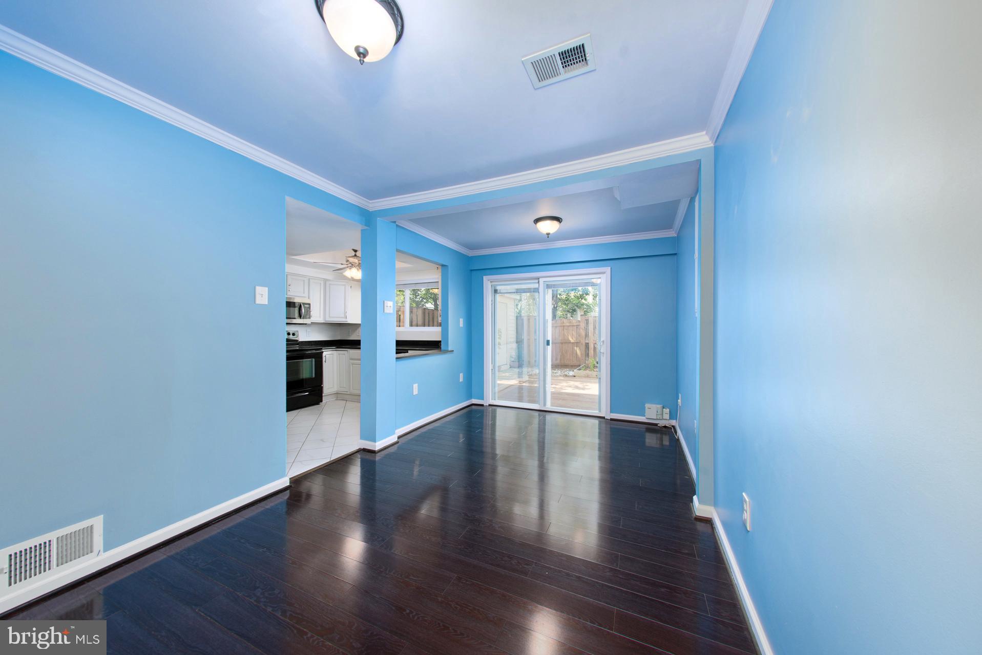13349 Shea Place Herndon, VA 20170 - Photo 10 of 26 a view of an empty room with wooden floor and a window