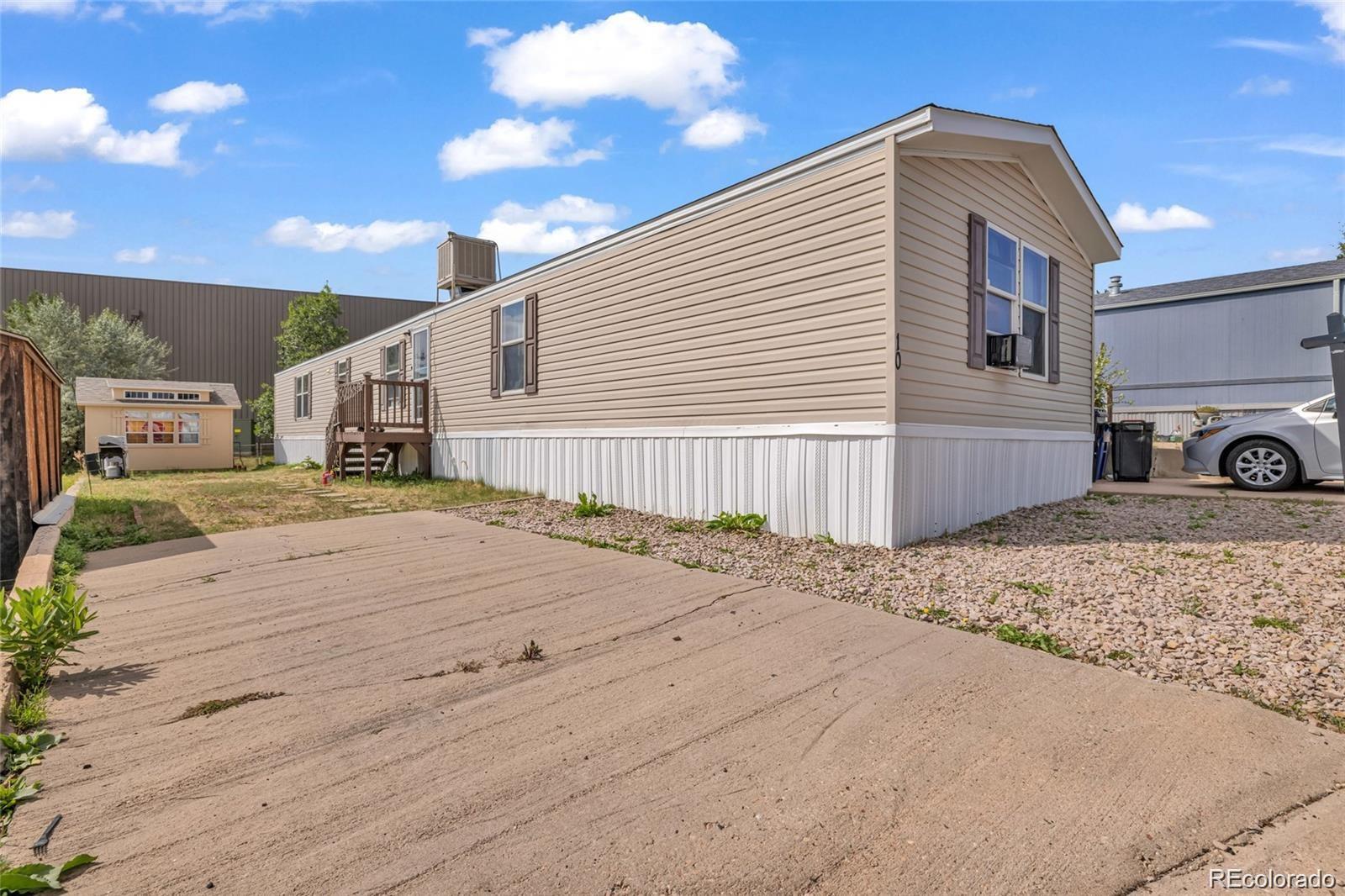 10 Jason Street Castle Rock, CO 80109 - Photo 9 of 11 a front view of a house with a yard