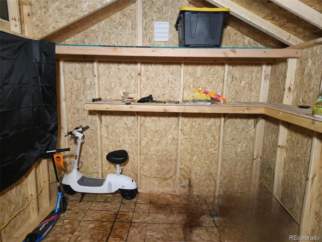 a bathroom with a toilet and a window