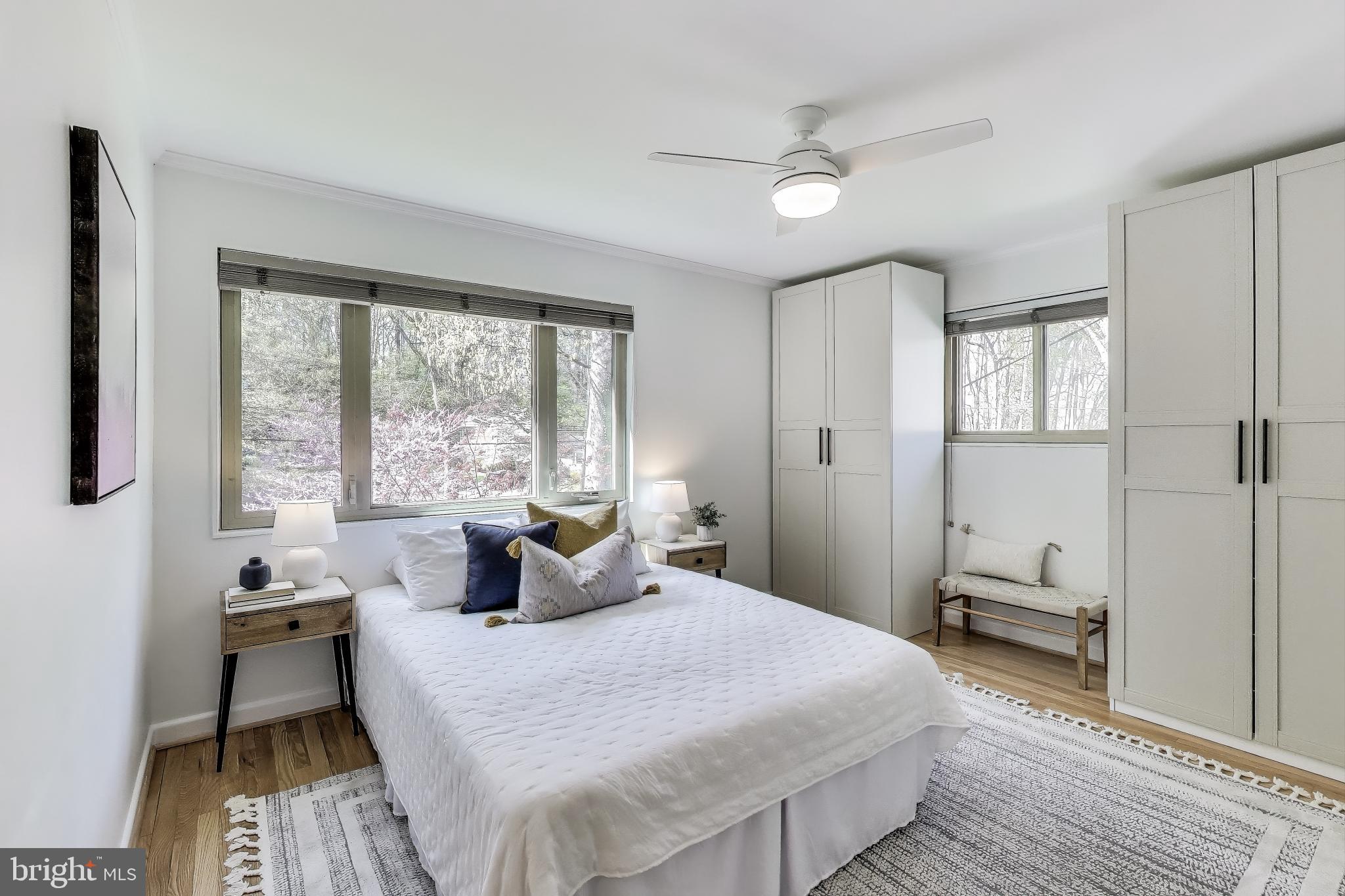 8905 Spring Valley Road Chevy Chase, MD 20815 - Photo 13 of 42 a bedroom with a bed and a window