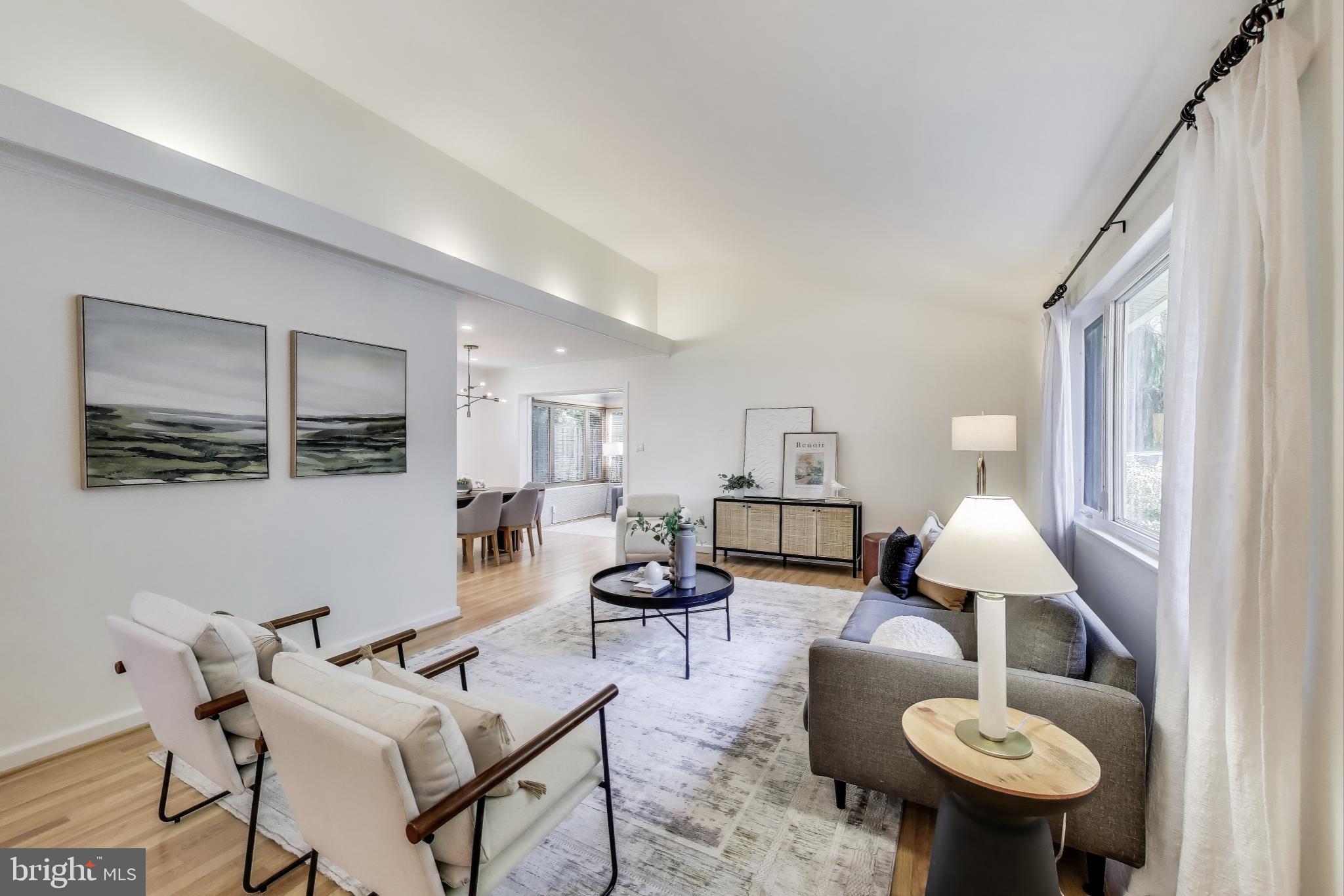 8905 Spring Valley Road Chevy Chase, MD 20815 - Photo 2 of 42 a living room with furniture and a mirror