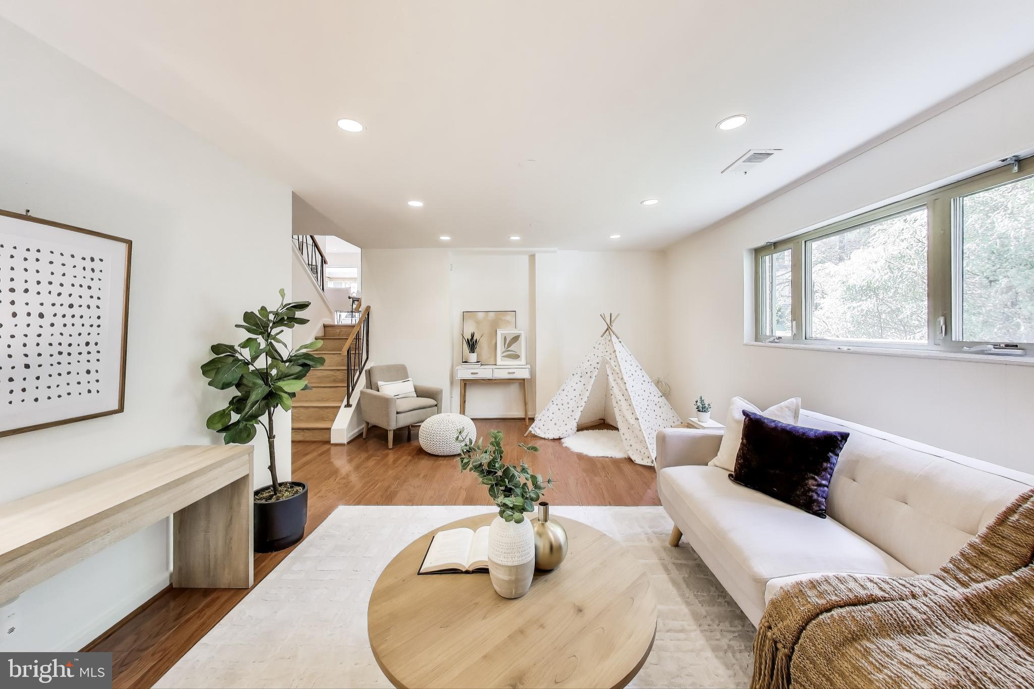 8905 Spring Valley Road Chevy Chase, MD 20815 - Photo 24 of 42 a living room with furniture or couch and a potted plant