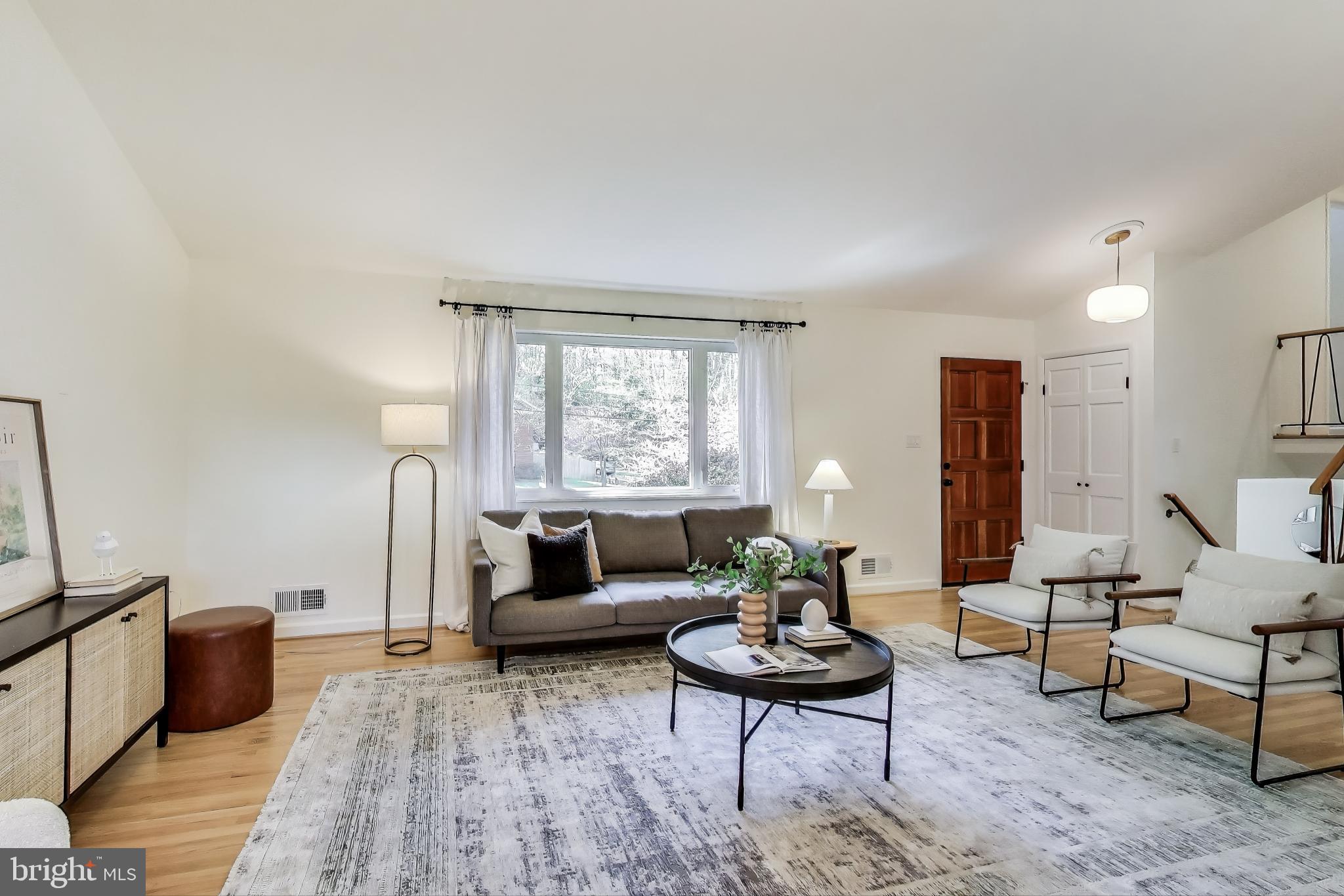 8905 Spring Valley Road Chevy Chase, MD 20815 - Photo 3 of 42 a living room with furniture and a rug