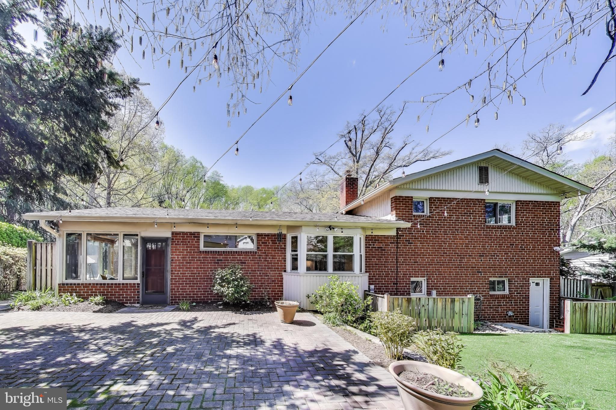 8905 Spring Valley Road Chevy Chase, MD 20815 - Photo 32 of 42 a view of a house with a yard