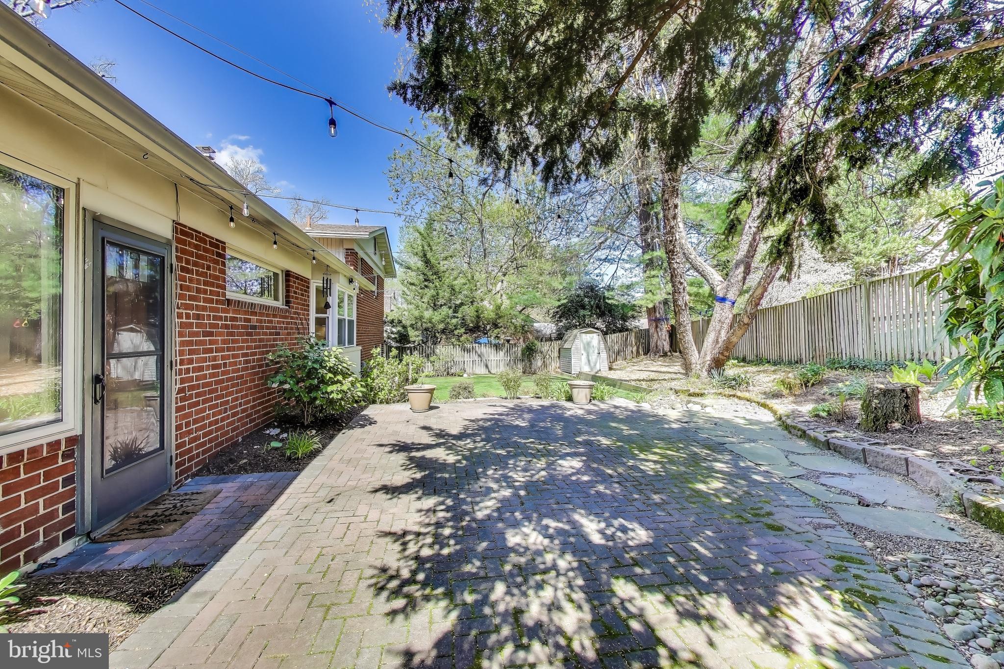 8905 Spring Valley Road Chevy Chase, MD 20815 - Photo 36 of 42 a view of a house with a yard