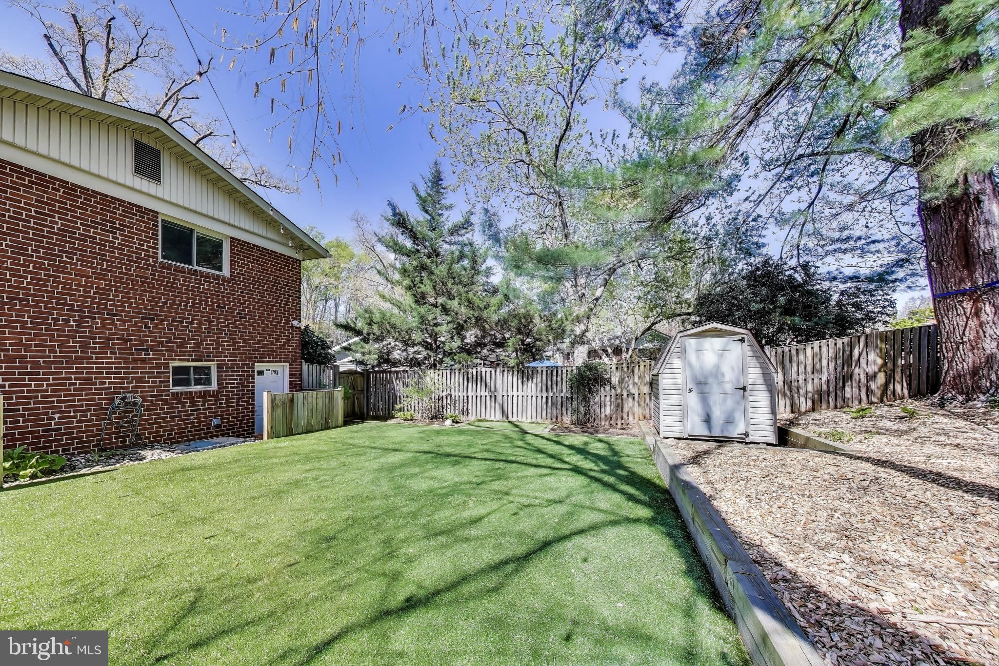 8905 Spring Valley Road Chevy Chase, MD 20815 - Photo 39 of 42 a view of a house with a yard
