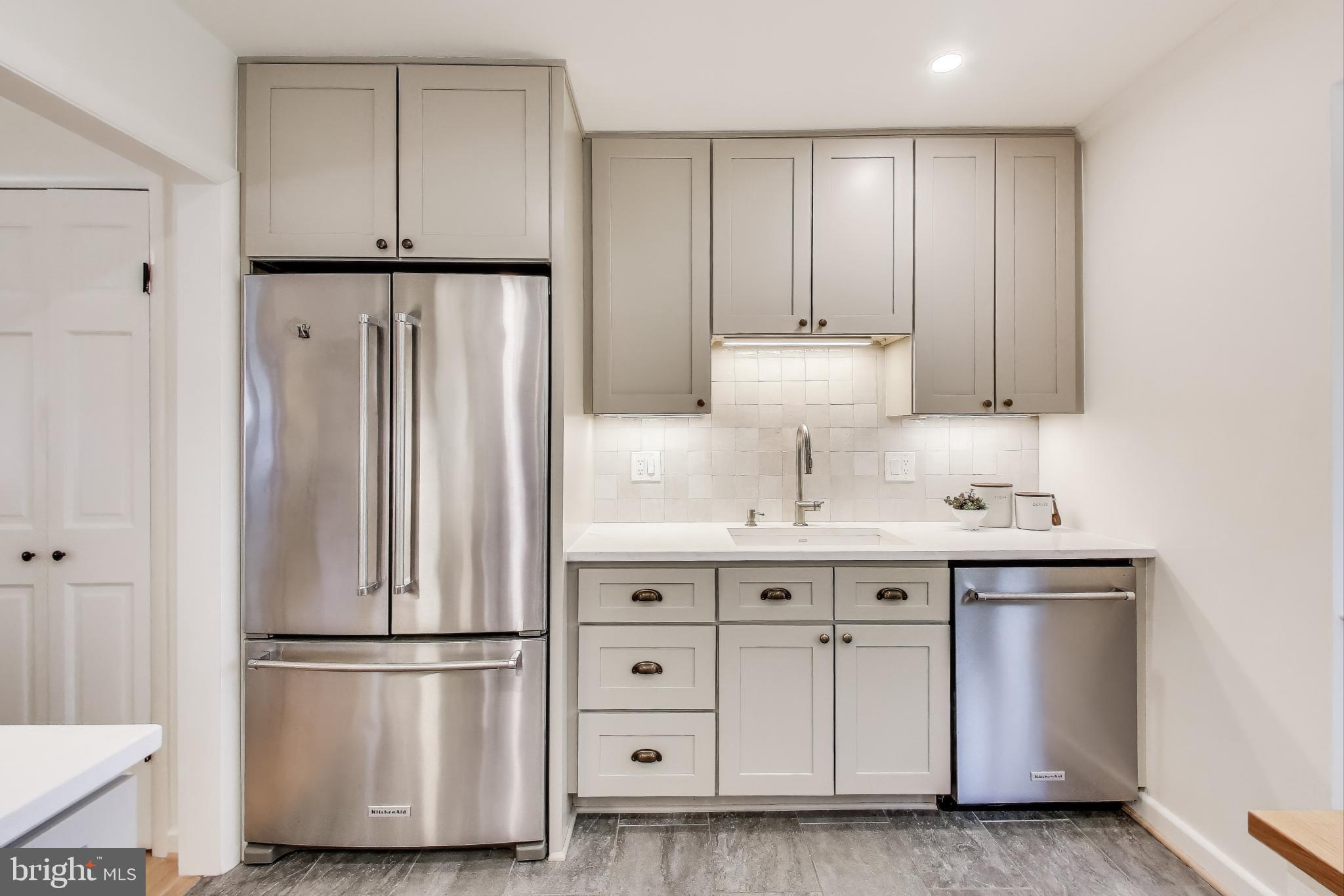 8905 Spring Valley Road Chevy Chase, MD 20815 - Photo 8 of 42 a kitchen with cabinets and stainless steel appliances