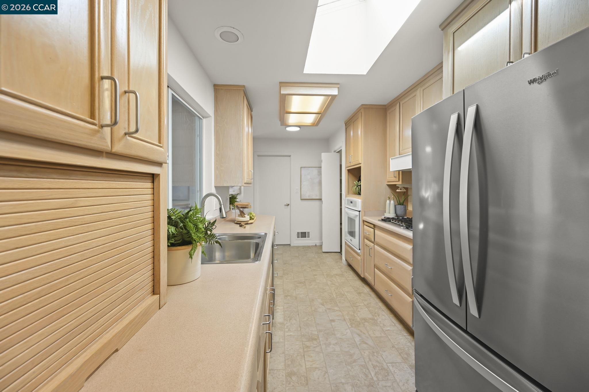 700 Miner Road Orinda, CA 94563 - Photo 14 of 37 a kitchen with stainless steel appliances a refrigerator and a stove