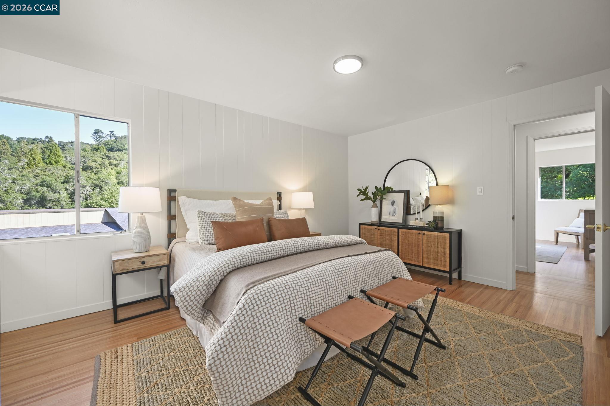 700 Miner Road Orinda, CA 94563 - Photo 20 of 37 a bedroom with furniture and a window