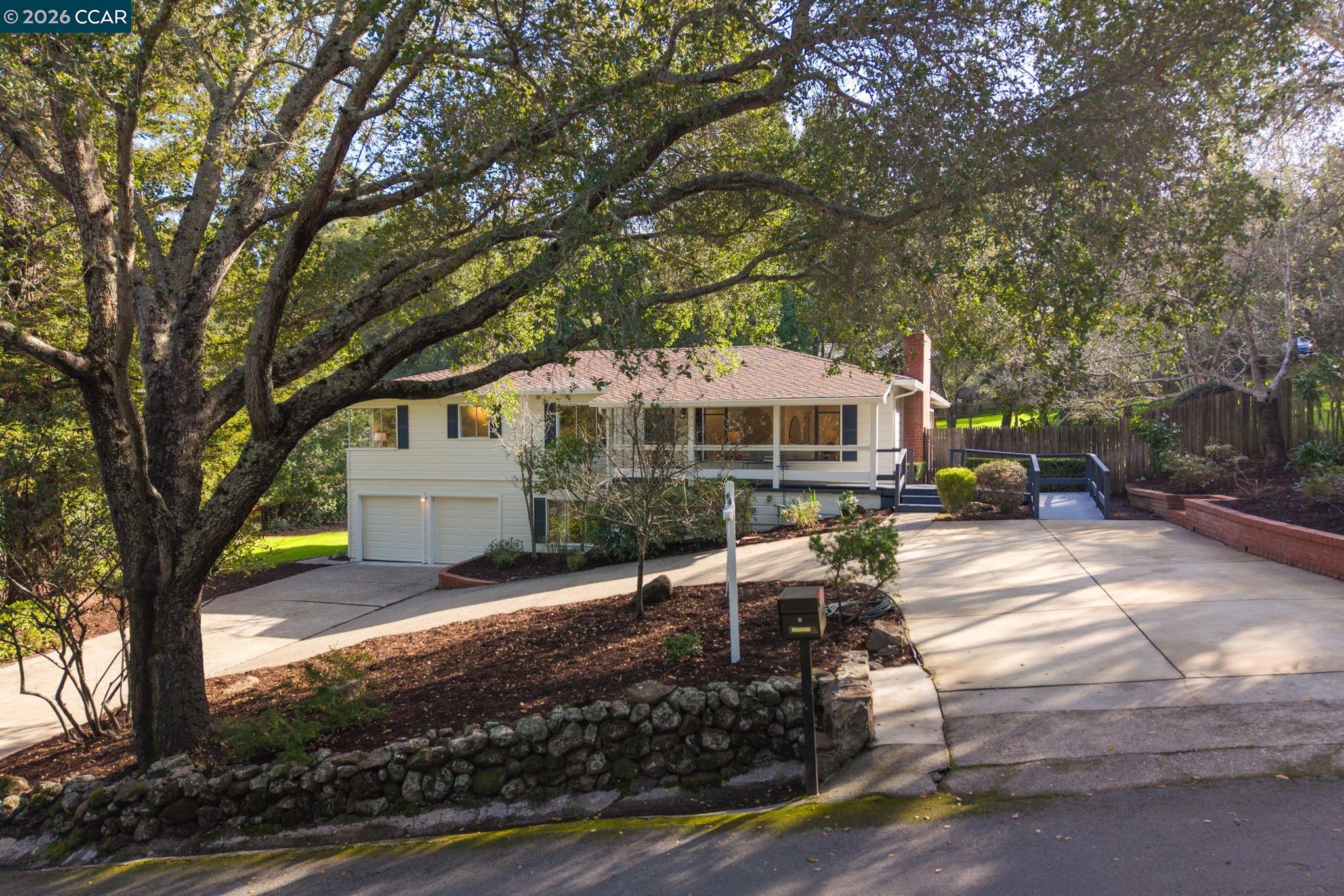 700 Miner Road Orinda, CA 94563 - Photo 2 of 37 a front view of a house with garden