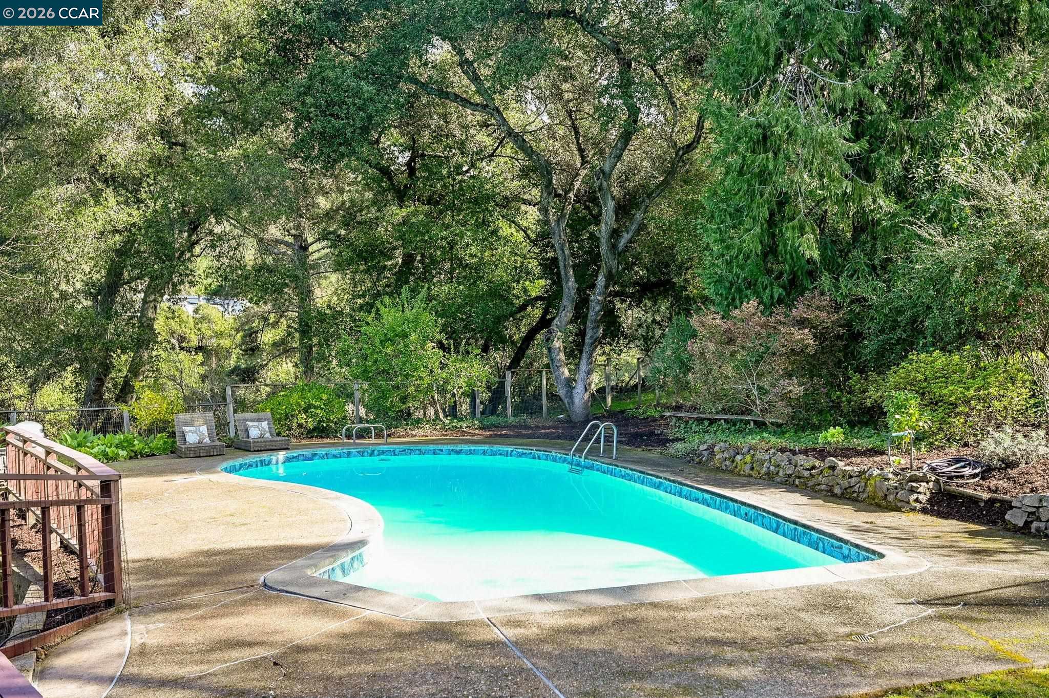 700 Miner Road Orinda, CA 94563 - Photo 30 of 37 a view of a swimming pool with a yard