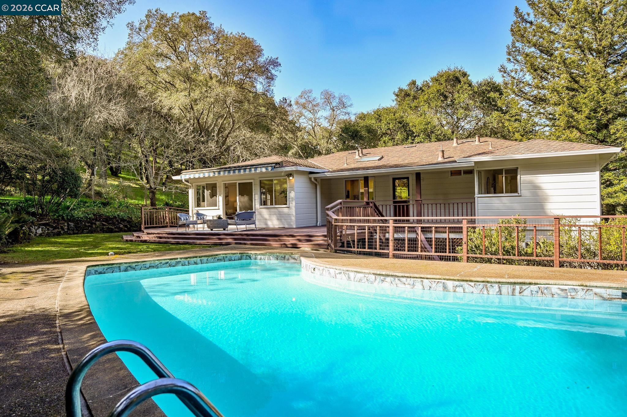 700 Miner Road Orinda, CA 94563 - Photo 31 of 37 a view of a house with swimming pool and porch