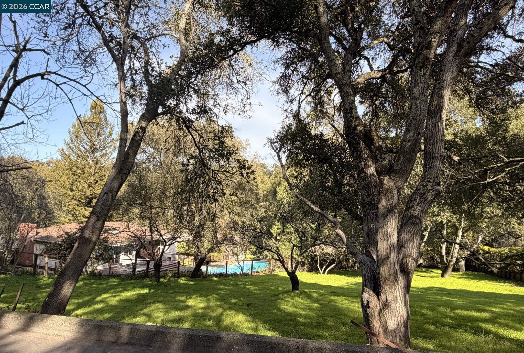 700 Miner Road Orinda, CA 94563 - Photo 34 of 37 a view of swimming pool with a garden